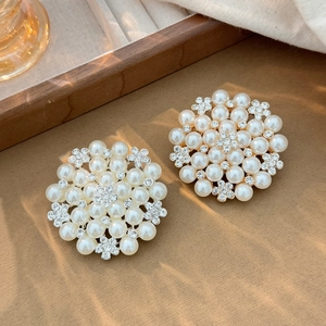 Elegant pearl and rhinestone sunflower brooch set with gold metal finish and sparkling crystals