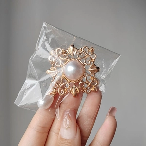 Vintage palace style hollow floral gold brooch with large round and teardrop pearls