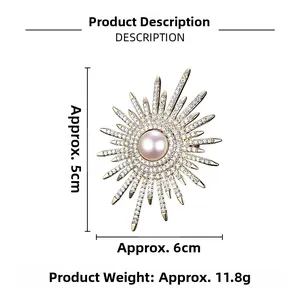 Detailed view of sunburst pearl brooch with sparkling white crystals in golden finish