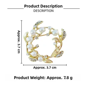 Detail view of a 3.7cm gold leaf brooch with white pearls and sparkling rhinestones