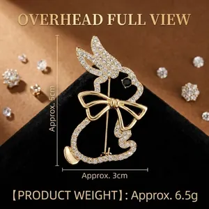 Broche lapin dorée élégante avec strass étincelants et yeux en pierres précieuses noires