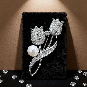 Elegant tulip flower brooch with shimmering rhinestones and a large white pearl inlay