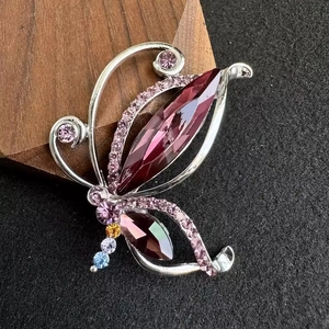 Vintage butterfly brooch with purple crystals and rhinestones in silver alloy setting