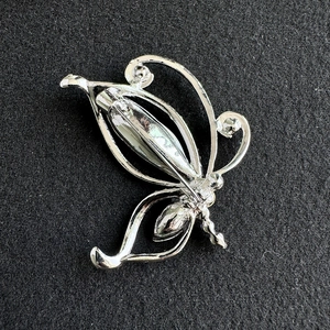 Detailed back view of the vintage butterfly brooch with secure pin clasp closure