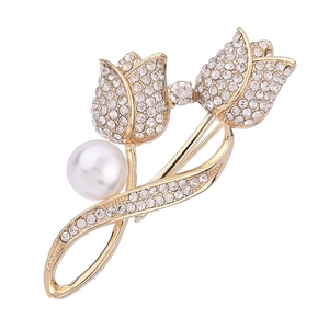 Elegant gold tulip brooch with sparkling rhinestones and a white pearl on white background