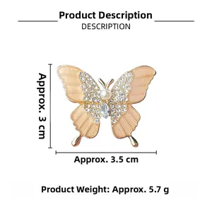 Detailed view of butterfly brooch with pearl, enamel wings and dimensions 3.5cm by 3cm
