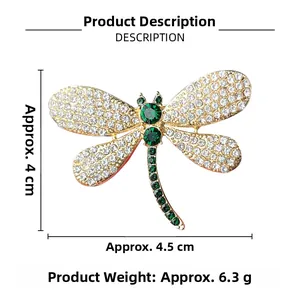 Detailed view of dragonfly brooch with green crystals and sparkling white stones