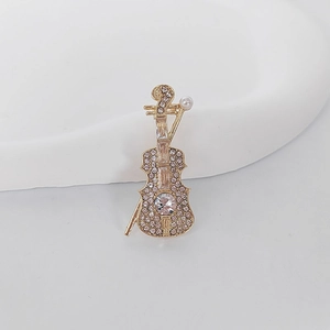 Exquisite violin brooch with pink and white rhinestones and a white pearl on golden base