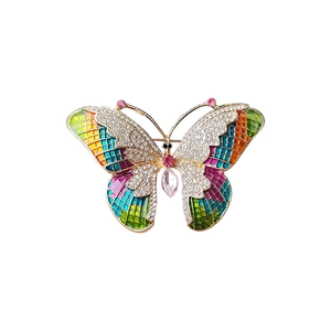 Elegant gold butterfly brooch with colorful mosaic enamel wings and sparkly rhinestones