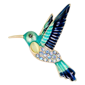 Eleganter Kolibri-Anstecknadel mit blauen Emaille-Federn und Kristallen auf Goldbasis