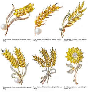 Détail des broches épis de blé en cristal montrant les dimensions et le poids précis