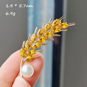 Broche blé dorée avec pierres jaunes et perle, dimensions de 1,9 par 5,7 cm environ