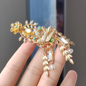 Vintage gold swallow brooch with tassel and emerald green stones for women suit decor