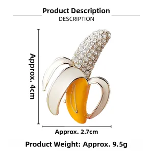 Detailed size view of a banana brooch with white crystals and yellow enamel finish
