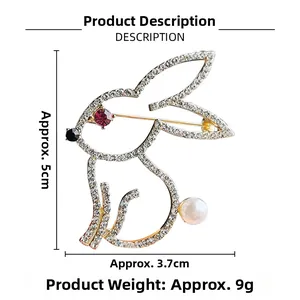 Detailed view of gold rabbit brooch with rhinestones and pearl showing dimensions