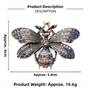 Detailed view of vintage bee brooch with blue and champagne rhinestones on wings