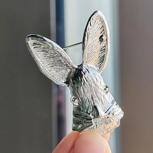 Cute Japanese rabbit brooch in bright silver finish with detailed fur texture and pin back