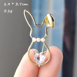 Close-up of rabbit brooch with pink heart crystal and white pearls, 1.9 by 3.7cm
