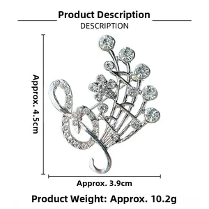Detail view of musical treble clef flower brooch with silver plating and crystals