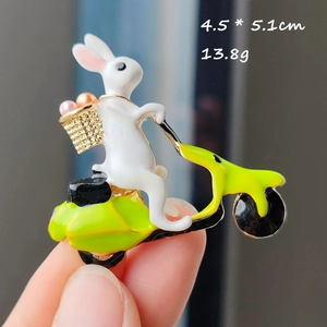 Cute bunny on neon green motorcycle enamel brooch pin with rhinestones and gold basket