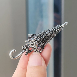 Vintage silver umbrella brooch with black rhinestones and colorful AB diamond accents