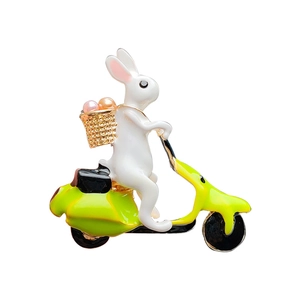 Cartoon rabbit riding a green scooter brooch with crystals and faux pearl accessories