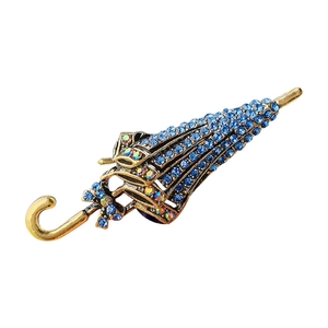Elegant umbrella brooch with blue and AB crystals on gold plated alloy setting