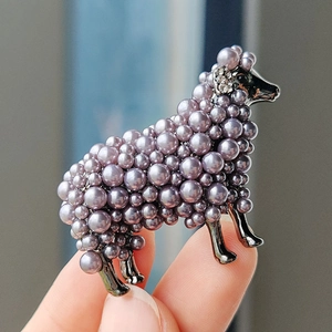 Cute retro sheep brooch with gray pearls and sparkling rhinestones on dark metal base