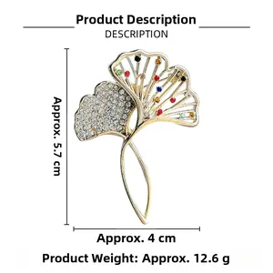 Detailed view of Ginkgo leaf brooch with colorful crystals and white rhinestones