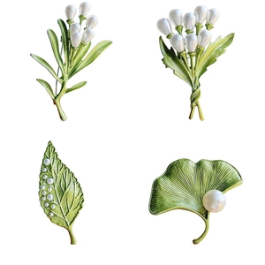 Fresh leaf and pearl brooch set in green enamel finish with four elegant botanical styles