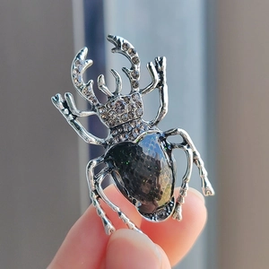 Vintage beetle brooch with silver alloy plating and green glitter stone for women