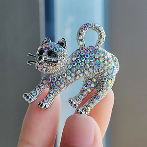 Sparkling cat animal brooch featuring colorful AB rhinestones on silver-toned alloy base