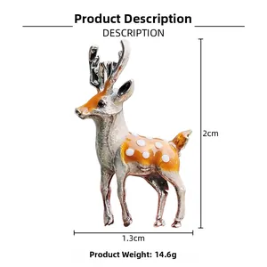 Detail view of enamel deer brooch with white spots, 2cm height and 1.3cm width dimensions