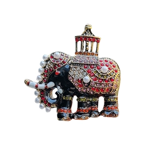 Exotic elephant brooch in vintage gold with colorful rhinestones and pearls