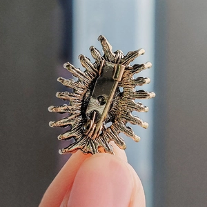 Vintage evil eye brooch in antique bronze finish with secure pin clasp back view