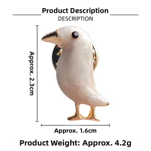 Detailed view of creative bird brooch with dimensions 2.3cm by 1.6cm and gold trim