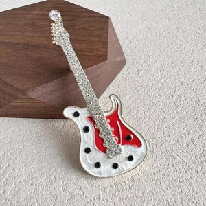 Minimalist electric guitar brooch with red white enamel and sparkling rhinestones