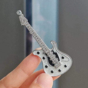Sparkling guitar brooch with silver alloy, crystal rhinestones, and pearl white enamel inlay