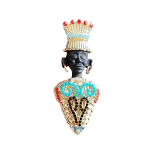Vintage tribal chief brooch with black matte finish and colorful gemstone inlays