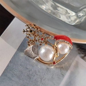 Elegant Christmas snowman brooch with pearls, red hat and sparkling crystals on gold pin