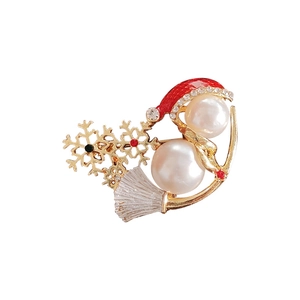 Cute Christmas snowman brooch with pearls, gold alloy, and red enamel hat on white background