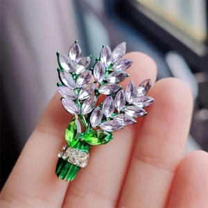 Elegant purple crystal bouquet brooch with lavender marquise stones and green leaves