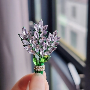 Elegant lavender crystal flower bouquet brooch with green leaves and pavé zircon accents