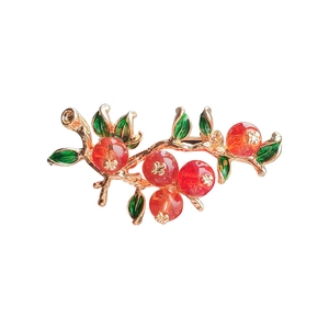 Elegant gold persimmon branch brooch with red beads and green enamel leaves