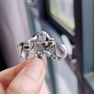 Reverse side of retro silver elephant brooch showing alloy metal and safety pin clasp