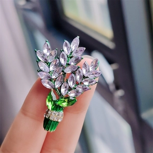 Elegant purple lavender crystal bouquet brooch with green leaves and sparkling rhinestones