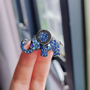 Sparkling blue rhinestone elephant brooch pin in vintage silver tone finish