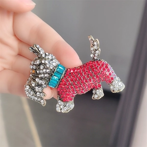 Retro puppy brooch pin with red and white crystals in vintage gold setting