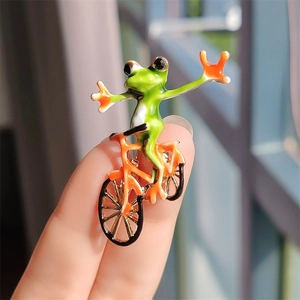 Funny green frog on orange bicycle enamel brooch pin for suits and coats