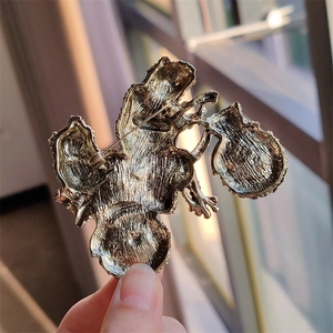 Detailed back view of vintage frog brooch showing secure metal safety pin clasp mechanism